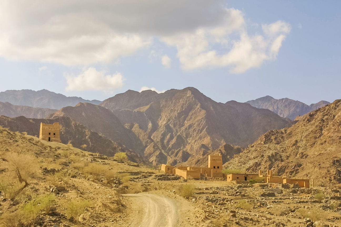 The approach to The Palace at Wadi Al Hayl in the Emirate of Fujairah in the United Arab Emirates. The Hajar Mountains are in the background.